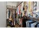 Walk-in closet featuring organized clothing racks and neutral colors at 9 W Glenhaven Dr, Phoenix, AZ 85045