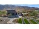 Aerial view of a community pool and recreational area with lush landscaping and mountain views at 9422 S 7Th Pl, Phoenix, AZ 85042