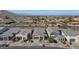 New construction modern home in quiet neighborhood surrounded by desert landscaping, sidewalks, and mountain views at 9422 S 7Th Pl, Phoenix, AZ 85042