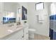 Bathroom featuring a shower with blue and white striped curtain and a single sink vanity at 9422 S 7Th Pl, Phoenix, AZ 85042