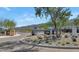 Gated community entrance with desert landscaping and mountain views at 9422 S 7Th Pl, Phoenix, AZ 85042