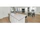 Open floor plan featuring modern kitchen with an island that opens to the living and dining area at 9422 S 7Th Pl, Phoenix, AZ 85042