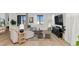 Bright and airy living area with a large sectional sofa, modern decor, and wood flooring, creating a cozy atmosphere at 9422 S 7Th Pl, Phoenix, AZ 85042