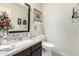 Stylish half bathroom with granite countertops and modern fixtures at 9809 W Wescott Dr, Peoria, AZ 85382