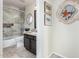Well-lit bathroom featuring a granite vanity, and shower/bath at 9809 W Wescott Dr, Peoria, AZ 85382