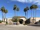 Lush entrance to the community's golf course and restaurant, lined with mature palm trees at 9809 W Wescott Dr, Peoria, AZ 85382