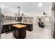 Open kitchen featuring stainless steel appliances, an island, and barstool seating at 9809 W Wescott Dr, Peoria, AZ 85382