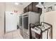 A well-lit laundry room with a washing machine, dryer, and cabinets for extra storage at 9809 W Wescott Dr, Peoria, AZ 85382