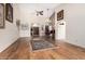 Spacious living room featuring hardwood floors and an arched entry way to the foyer at 9809 W Wescott Dr, Peoria, AZ 85382