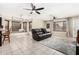 Cozy living room features tile floors, recessed lighting, and a large window seat at 9809 W Wescott Dr, Peoria, AZ 85382