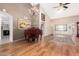 Spacious living room featuring hardwood floors, vaulted ceilings, and a chandelier at 9809 W Wescott Dr, Peoria, AZ 85382