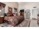 Spacious main bedroom with a large bed, a window, and an ensuite bathroom at 9809 W Wescott Dr, Peoria, AZ 85382