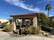 Outdoor gazebo with comfortable seating, mature trees, and serene water feature at 9809 W Wescott Dr, Peoria, AZ 85382