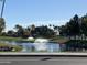 Scenic pond with fountains and lush greenery, providing a tranquil atmosphere at 9809 W Wescott Dr, Peoria, AZ 85382