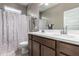 Bathroom with a double sink vanity, tile flooring and combination shower and tub at 1039 W Tuli Way, San Tan Valley, AZ 85143