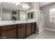 Modern bathroom features a double sink vanity and glass-enclosed shower at 1039 W Tuli Way, San Tan Valley, AZ 85143