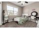 Bedroom featuring a vanity table, mirror and a large sunny window at 1039 W Tuli Way, San Tan Valley, AZ 85143