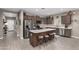 Modern kitchen featuring stainless steel appliances, a large island, and ample cabinet space at 1039 W Tuli Way, San Tan Valley, AZ 85143