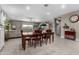 Open concept living and dining space with tile floors, neutral paint, and stylish furniture at 1039 W Tuli Way, San Tan Valley, AZ 85143