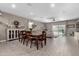 Open concept living and dining space with tile floors, neutral paint, and large windows at 1039 W Tuli Way, San Tan Valley, AZ 85143