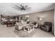 Open-concept layout showing the living room seamlessly connected to the kitchen and dining area at 1039 W Tuli Way, San Tan Valley, AZ 85143