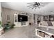 Spacious living room featuring stylish décor, tile floors, and plenty of natural light at 1039 W Tuli Way, San Tan Valley, AZ 85143