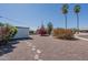 Landscaped front yard featuring drought-tolerant plants and a rock groundcover for low maintenance at 11214 N 105Th Ave, Sun City, AZ 85351