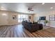 Bright living room featuring wood-look floors, and neutral wall colors at 11214 N 105Th Ave, Sun City, AZ 85351