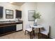 Well-organized kitchen space with coordinated black cabinets, a marble table, and bright neutral decor at 1126 W Elliot Rd # 1024, Chandler, AZ 85224