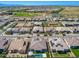 An aerial view of homes in a modern, planned community close to parks and green spaces at 11807 W Parkway Ln, Avondale, AZ 85323