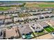 An aerial view of a residential neighborhood featuring well-manicured lawns and a community park at 11807 W Parkway Ln, Avondale, AZ 85323