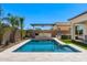 Stunning backyard with a pool, outdoor kitchen, and a well-manicured landscape, perfect for gatherings at 11807 W Parkway Ln, Avondale, AZ 85323