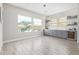 Bright dining area with built-in cabinets, wine fridge, and a view of outdoor space at 11807 W Parkway Ln, Avondale, AZ 85323