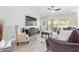 Comfortable living room with a ceiling fan, large sliding glass doors, and neutral decor at 11807 W Parkway Ln, Avondale, AZ 85323