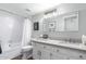 Neutral bathroom featuring a shower over tub, white vanity, modern mirror, and fixtures, providing a functional and updated space at 1211 N Miller Rd # 258, Scottsdale, AZ 85257