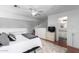 Bright bedroom showcasing a ceiling fan, stylish decor and an en suite bathroom at 1211 N Miller Rd # 258, Scottsdale, AZ 85257