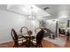 Dining area with seating, stylish lighting and adjacent living room at 1211 N Miller Rd # 258, Scottsdale, AZ 85257