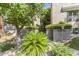 Inviting building entrance with landscaped greenery, providing a warm and welcoming atmosphere to the property at 1211 N Miller Rd # 258, Scottsdale, AZ 85257