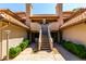 Attractive building exterior with dual stairways and desert landscaping, providing curb appeal for residents at 1211 N Miller Rd # 258, Scottsdale, AZ 85257