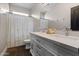 Bright bathroom with a double sink vanity and a shower/tub combination at 122 W Raven Dr, Chandler, AZ 85286