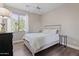 Bedroom featuring a full-sized bed, neutral paint, and a large window at 122 W Raven Dr, Chandler, AZ 85286