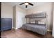 Bedroom featuring bunk beds, wood-look flooring, and a ceiling fan at 122 W Raven Dr, Chandler, AZ 85286