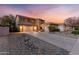 This home features a two-car garage and neutral color scheme at 122 W Raven Dr, Chandler, AZ 85286