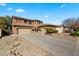 Well maintained home with a three-car garage and desert landscaping at 122 W Raven Dr, Chandler, AZ 85286