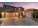 This home features a two-car garage and neutral color scheme at 122 W Raven Dr, Chandler, AZ 85286