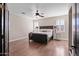 Comfortable main bedroom featuring a large dark wood bed frame and neutral paint at 122 W Raven Dr, Chandler, AZ 85286