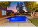 Backyard pool with lush landscaping, perfect for relaxation and outdoor entertainment at 122 W Raven Dr, Chandler, AZ 85286