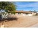 Exterior view of home with landscaped front yard and single car garage at 12608 W Lower Buckeye Rd, Avondale, AZ 85323