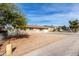 Front yard exterior view of single-story home with driveway and gravel landscaping at 12608 W Lower Buckeye Rd, Avondale, AZ 85323