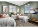 Comfortable bedroom with matching twin beds, bright decor, and scenic views at 12642 W Parkway Ln, Avondale, AZ 85323